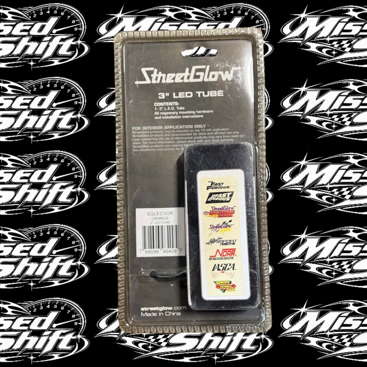 StreetGlow 3 inch orange LED tube, back of original packaging on Missed Shift logo background