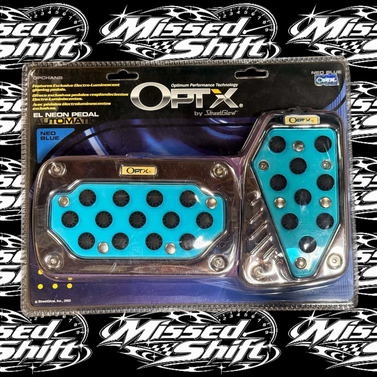 Front of OPTX by StreetGlow Neo Blue chrome automatic EL neon pedal set, original 2002 packaging, on Missed Shift background