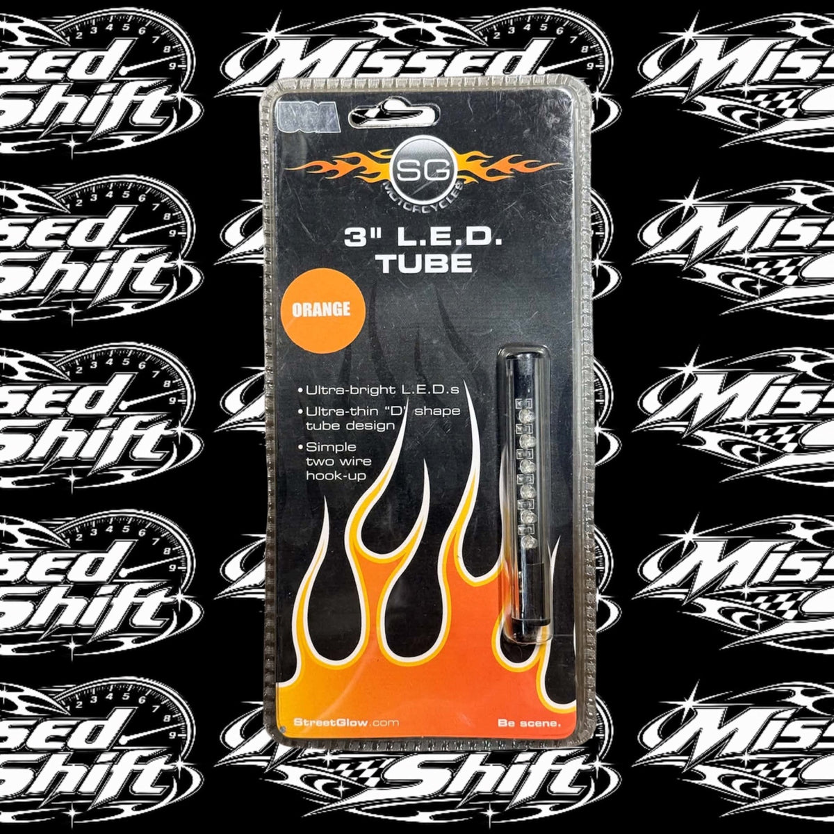 StreetGlow 3 inch orange LED tube, front of original packaging on Missed Shift logo background