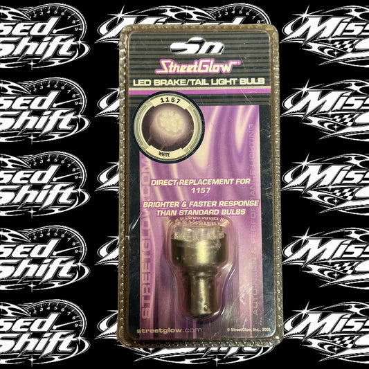 StreetGlow white LED 1157 brake and tail light bulb in original 2005 package on Missed Shift logo background