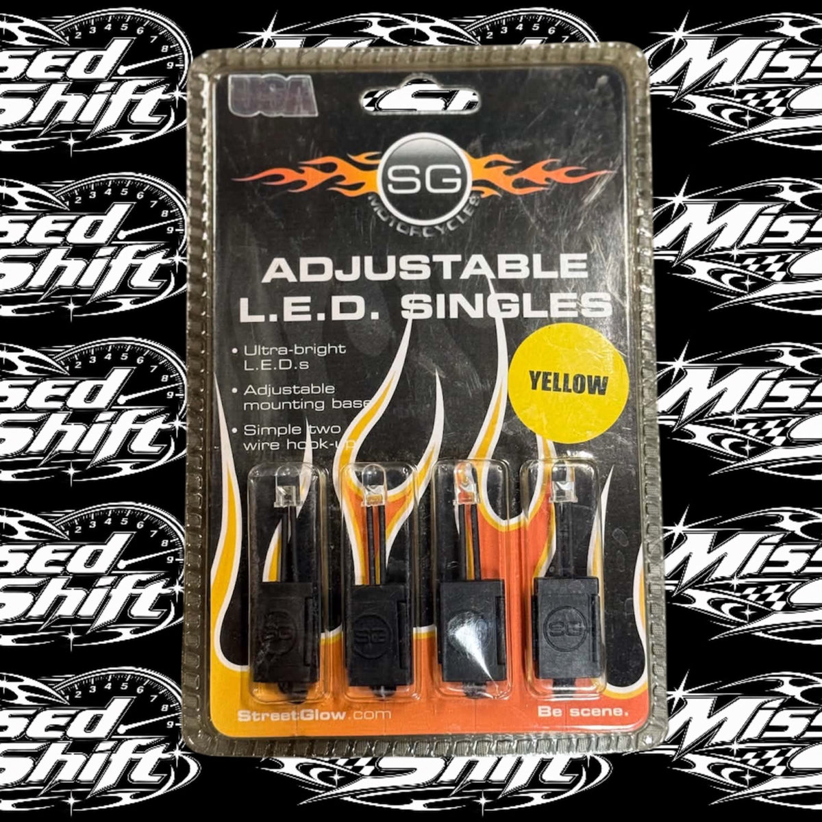 Streetglow yellow adjustable LED singles in original package on Missed Shift logo background