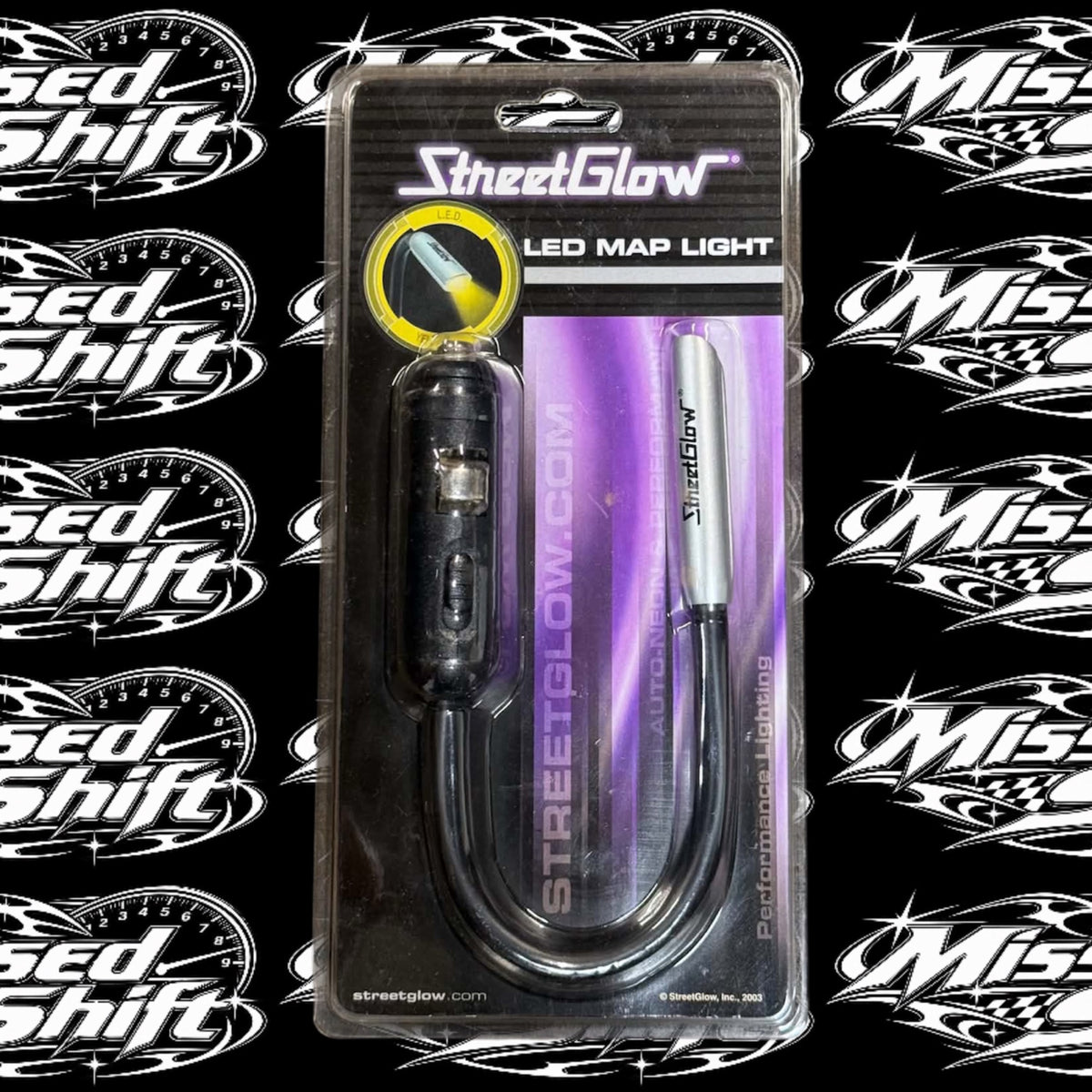 StreetGlow yellow LED map light in original 2003 packaging on Missed Shift logo background